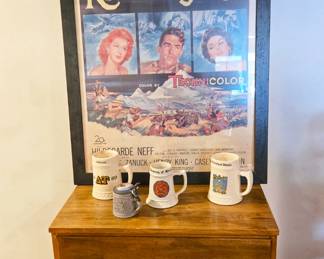 Mid-century modern dresser and vintage framed poster.