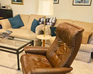 Leather swivel rocker.