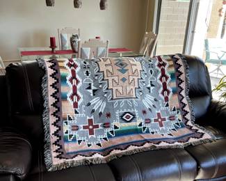 Vibrant throw displayed for sale. Sofa not available.