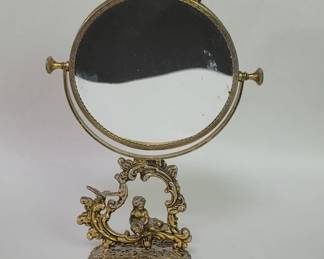 Vintage spelter figural dual sided table mirror