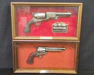 Pair of vintage Seagrams Benchmark premium bourbon gun wall sign cases