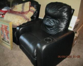 one of 4 theater leather chairs