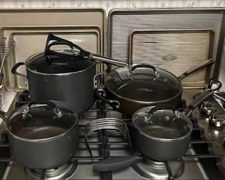 Calphalon. 2 different brands of bakeware. The one on the left didn't appear to have been used much or at all.