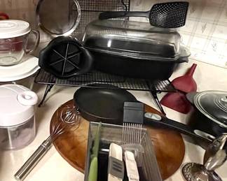 More PC - check out that croc type bakeware on the right in the back, and the rectangular bake set atop the cookie rack (there are 2), meat tenderizer, mixed hand held kitchen tools, a well seasoned pizza stone, a small sauce pan, apple slicer, strainer, straining spoon, egg picker upper (I couldn't think of it's real name), and coveted and covered glass measuring bowls, and more.....I had to go into detail because these are just awesome items.