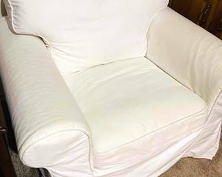 1 of 2 white slip covered arm chairs. Slip covers are removable and machine washable. Great for kids, pets, or that messy someone in you house....(if you don't have a messy someone, you are blessed).