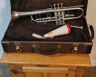 Gorgeous Trumpet in original case, and check out that cute side table it's on.