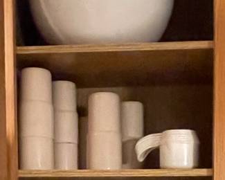 Vintage Tupperware on bottom and second shelf, modern town w/pink lid