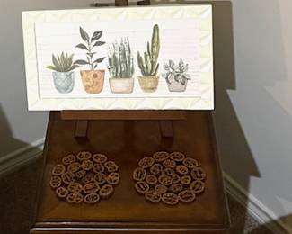 1 of 2 lovely end tables. Cute plant pic. And check out those walnut shell slice decorative trivets - talk about unique.