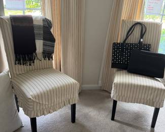 A set of four Parsons chairs with eight slip covers