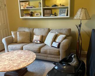 Hideabed sofa, marble top coffee table, child’s Mercedes sold
