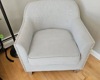 Upholstered accent chair with nail trim detail 