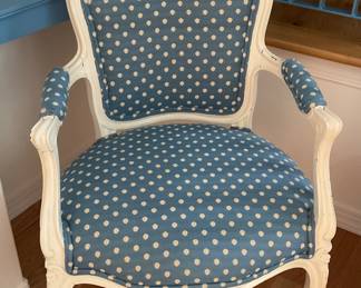 Two captain-style polka dot chairs.