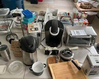 Assorted kitchen items in garage - including two Keurig coffee machines