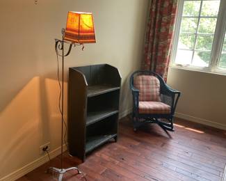 Rustic shelf, painted wicker rocking chair and lamp