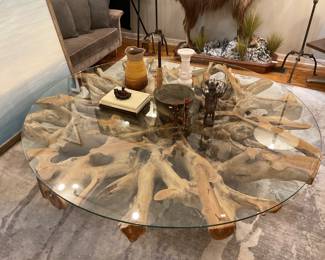 Large round driftwood coffee table with glass top; Diameter: 79" Height: 12" $3150 + tax