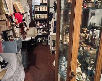 Curio with figurines. Collectible dolls: Effanbee, Kais Heirloom collection, Lee Middleton, Great American Women of the USA Historical Society and more.