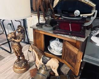 Panasonic television, floor lamp, decorative boxes, vintage victrola, various statues