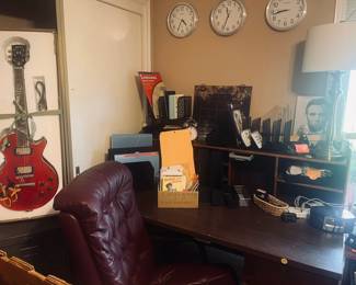 Gibson guitar, desk, chair, clocks, lamp, office organizers