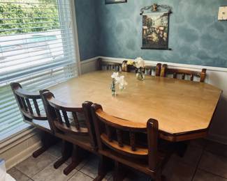 Kitchen table with six chairs, wall art