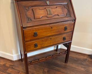 Antique writing desk and vintage clock