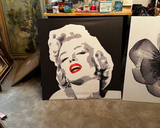 Marilyn Monroe poster and various candles and decorations