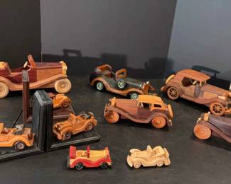 Collection of handcrafted vintage wooden toy cars