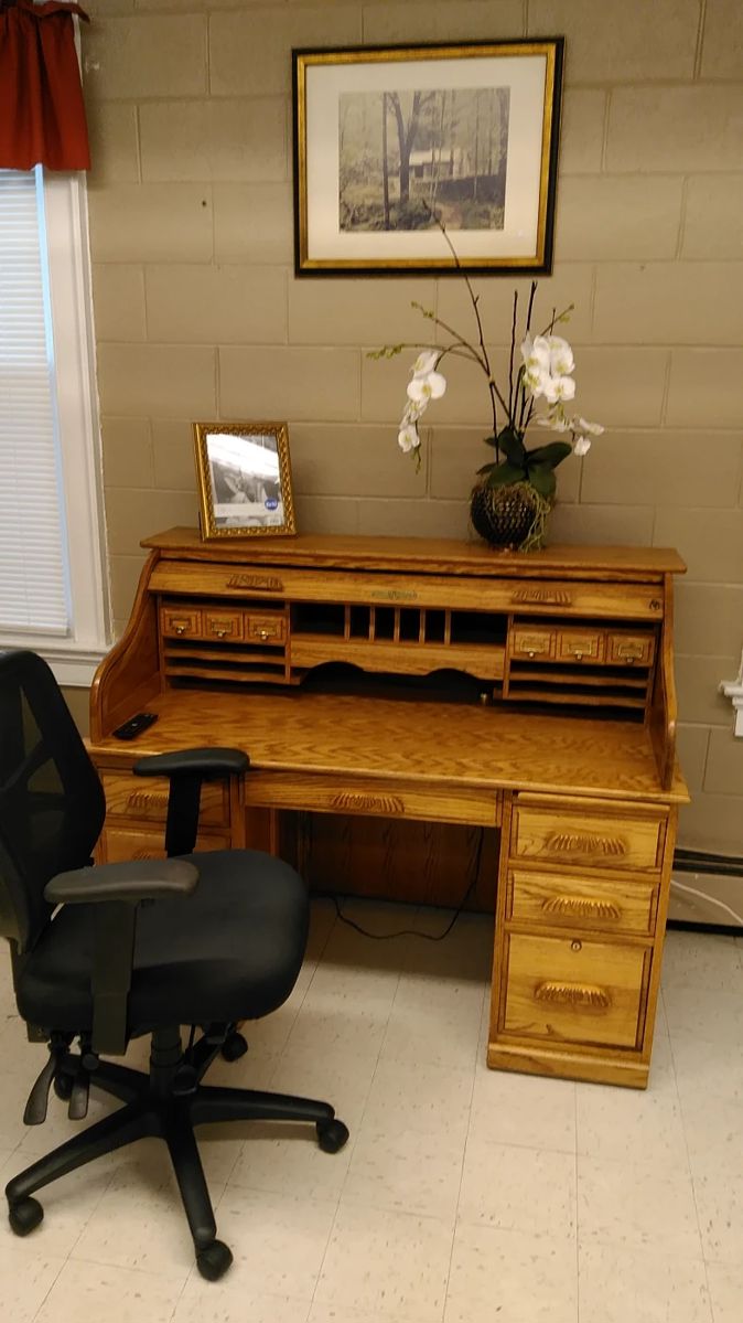 Beautiful roll-top desk, comfortable office chair, framed print