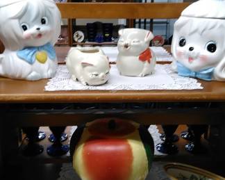 Vintage cookie jars with piggy creamer and sugar