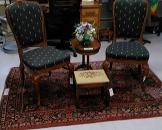 Upholstered side chairs flanking an oval side table with gallery, Needlepoint foot stool, Quality Asian rug