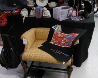 Comfortable vanity bench surrounded by fashion and collectibles just for you!