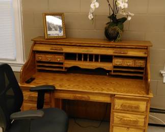 Beautiful roll-top desk, comfortable office chair, framed print