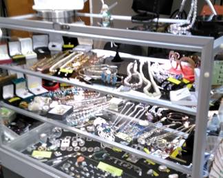Showcase with a great assortment of estate jewelry (gold, sterling, diamonds) and other items.