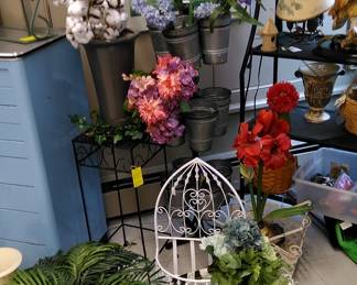 Garden has lots of flowers (a few plants are real).