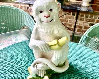 Playful ceramic monkey