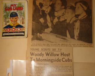 Vintage newspaper and cub scout card associated with Cub Scout shirt