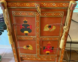 Ornate Wood Cabinet Featuring Stylized Deity Artwork