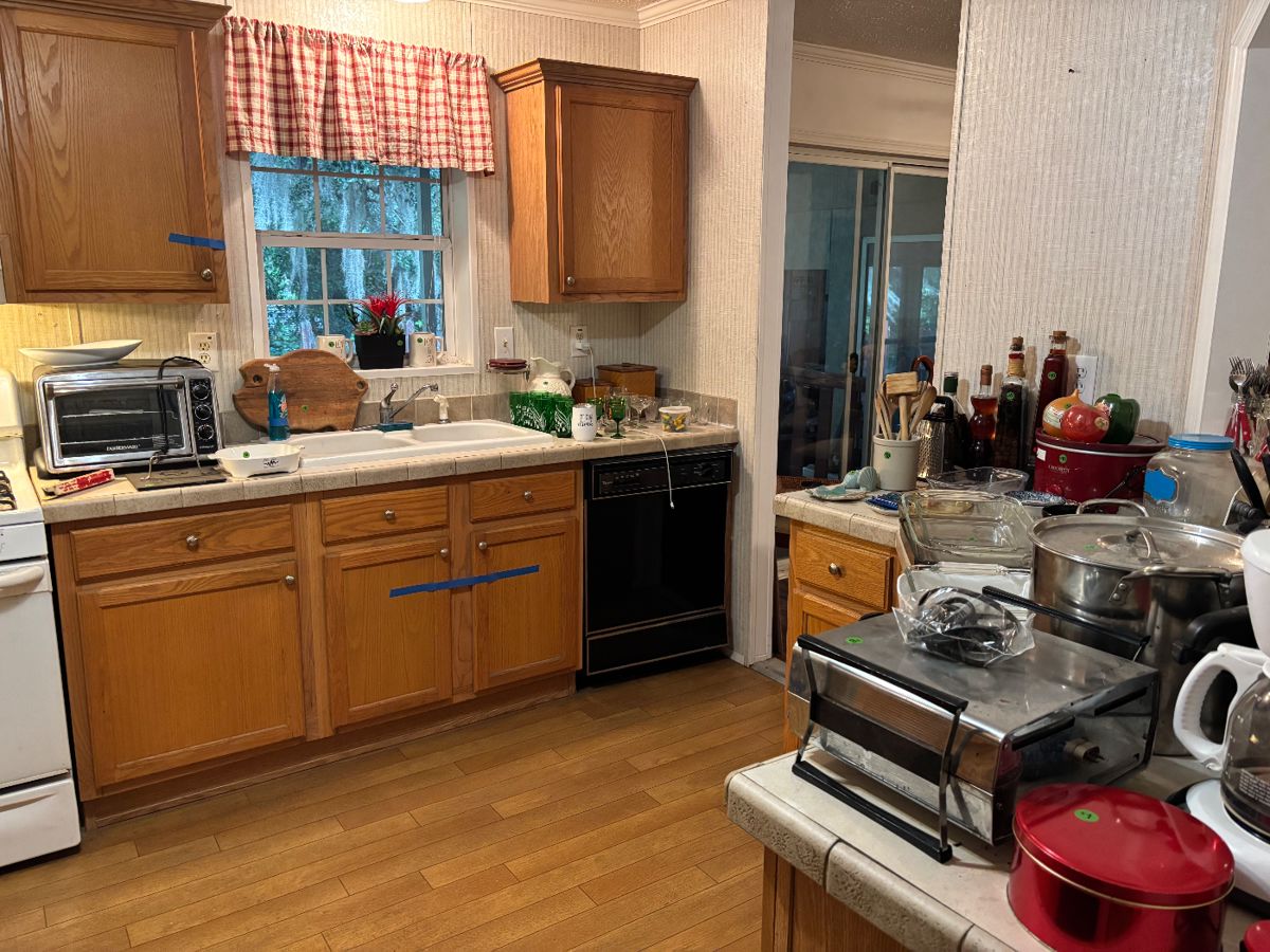 Kitchen, full of gadgets, kitchenware, and glassware