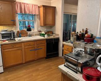 Kitchen, full of gadgets, kitchenware, and glassware
