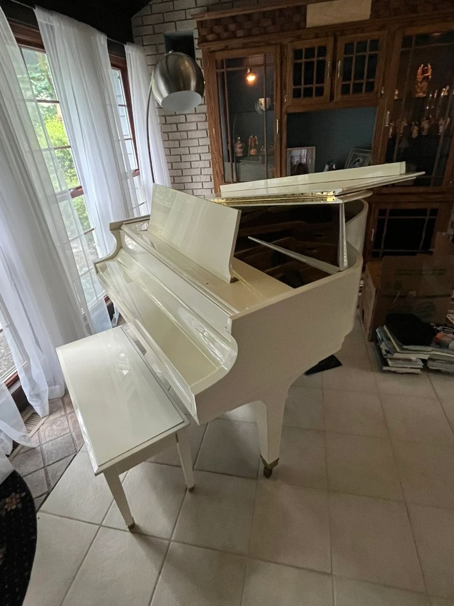 Baldwin ivory baby grand piano