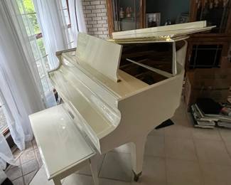 Baldwin ivory baby grand piano