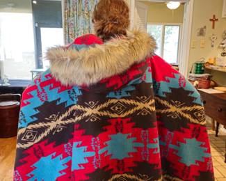 Very large poncho with fur trimmed hood