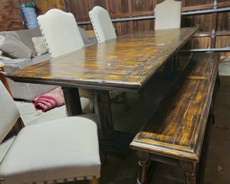 90" table with two additional 18" leaves. Bench and 4 large upholstered chairs, as shown.