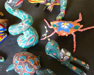 Collection of small Mexican folk art carvings.