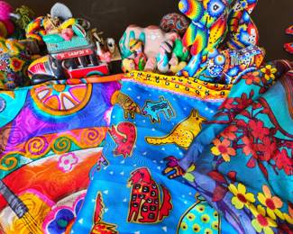 Whimsical scarves and Mexican toys in background