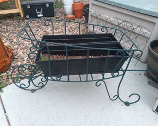 Wrought iron wheelbarrow planter