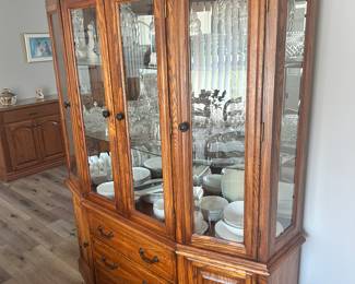 A very nice lighted China cabinet.