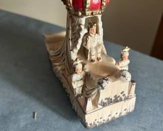 King Rex float porcelain statue with container.