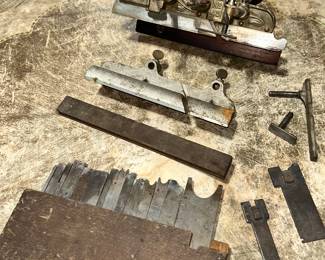 Stanley #45 combination plane, a Stanley #5 nosing tool (fits on the Stanley 45) and approximately 19 blades/cutters in their wood frame for the 45.