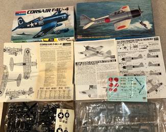 These two airplane models need to be put together by you! One on the left is the Corsair F4U - 4 by Monogram. One on the right is the Mitsubishi A6M3 Zero Fighter Type 32 ‘Houkoku’ by Hasegawa.