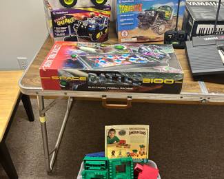 Remote control Street Quake (NIB), remote control Stormentor (NIB), space battle 2001 pinball game (also NIB), and a tub of Lincoln logs!!